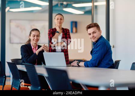 A team of successful programmers sits in a startup office, strategizing new business projects and solving existing challenges, s Stock Photo