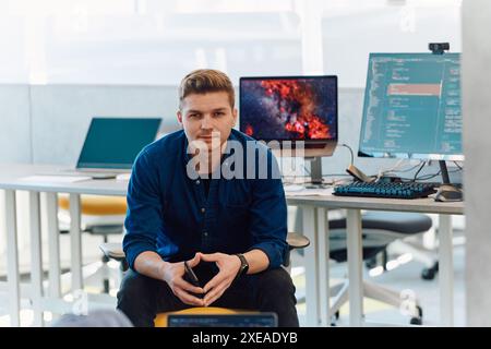 Programming. Man Working On Computer In IT Office, Sitting At Desk Writing Codes. Programmer Typing Data Code, Working On Projec Stock Photo