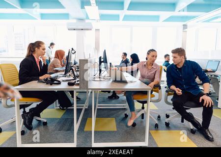 Collaborative process of multicultural skilled young business team during brainstorming meeting in office.Diverse group of young Stock Photo