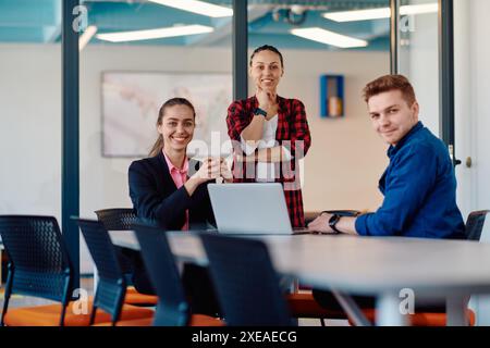 A team of successful programmers sits in a startup office, strategizing new business projects and solving existing challenges, s Stock Photo