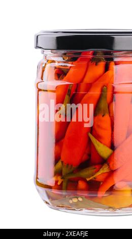 Glass jars with pickled chili peppers on white background Stock Photo