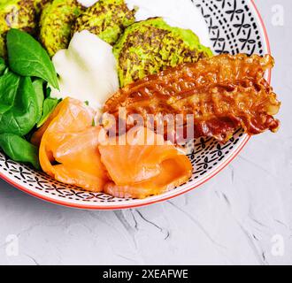 Pumpkin pancakes with fried bacon and salmon Stock Photo