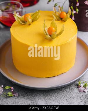 Tasty mango mousse cake on plate Stock Photo