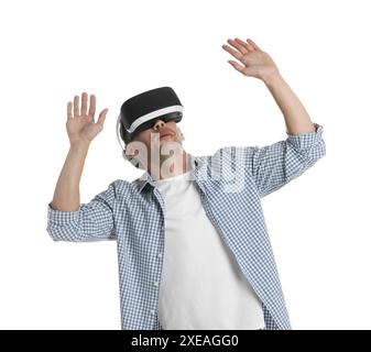 Smiling woman using virtual reality headset on pink background, space for text Stock Photo