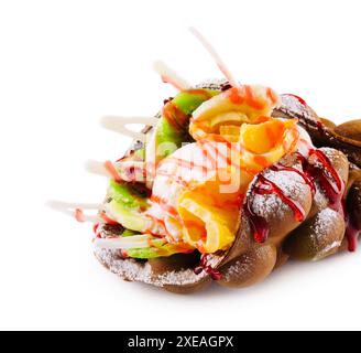 Egg waffle with ice cream and fruits with syrup Stock Photo