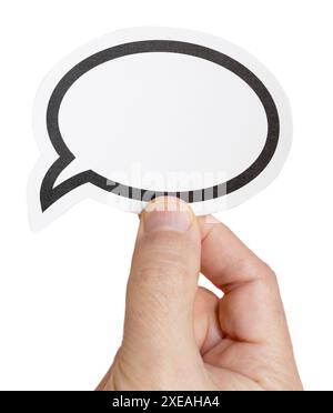 Hand holding a blank speech bubble isolated on white background. Template Mockup Stock Photo