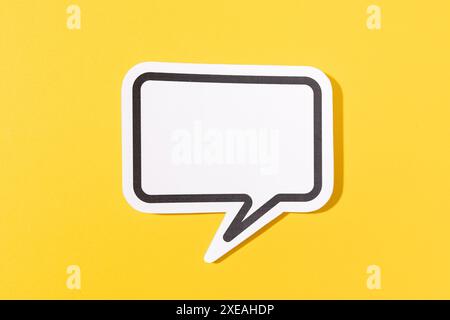 Blank Speech Bubble isolated on yellow background. Mock up template Stock Photo