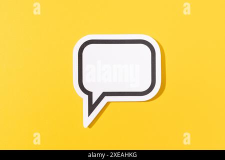 Blank Speech Bubble isolated on yellow background. Mock up template Stock Photo
