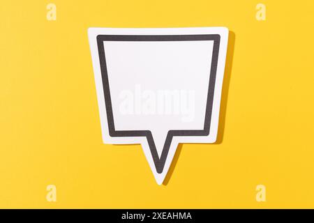 Blank Speech Bubble isolated on yellow background. Mock up template Stock Photo