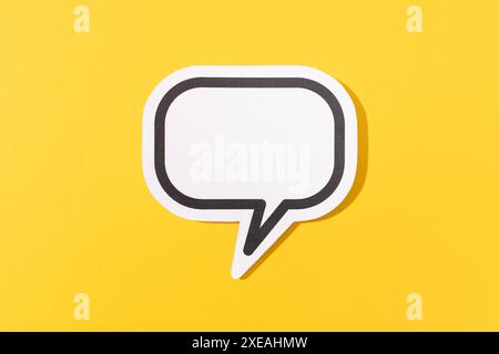 Blank Speech Bubble isolated on yellow background. Mock up template Stock Photo