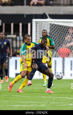 Las Vegas, NV, USA. 26th June, 2024. Ecuador midfielder Moisés Caicedo (23) and Jamaica defender Joel Latibeaudiere (15) battle for the ball during the CONMEBOL Copa America Group B Stage match at Allegiant Stadium between Ecuador and Jamaica on June 26, 2024 in Las Vegas, NV. Christopher Trim/CSM (Credit Image: © Christopher Trim/Cal Sport Media). Credit: csm/Alamy Live News Stock Photo