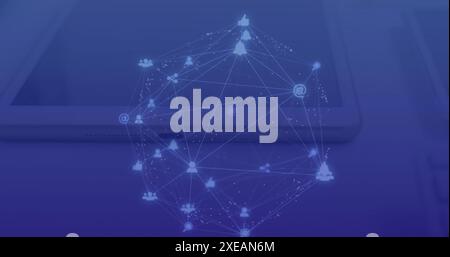 Image of connected dots forming globe over overhead view of digital tablet and laptop on table Stock Photo