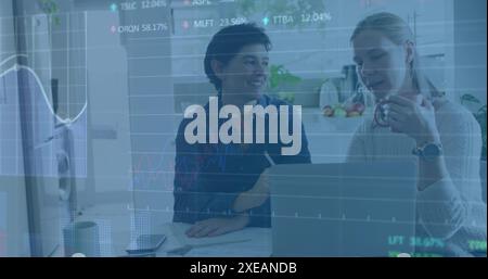 Image of multiple graphs, trading board, caucasian female analyzing reports on laptop Stock Photo