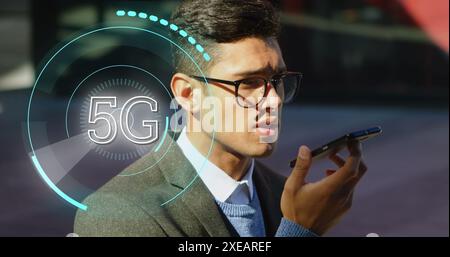 Image of african american businessman in office over strong man wearing vr headset Stock Photo