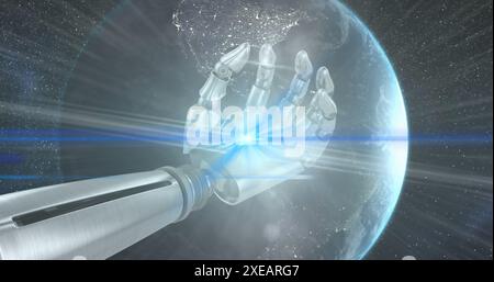 Image of light trails over robotic hand and globe on black background Stock Photo