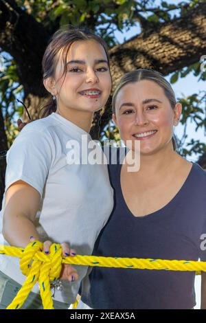 Aunt and niece posing as models outdoors Stock Photo - Alamy