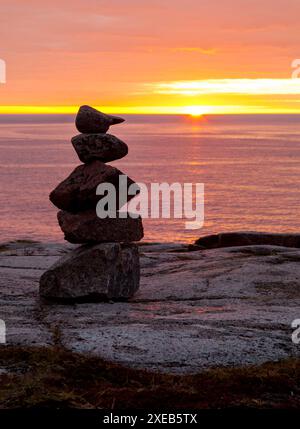 Tower of stones on the coast of Barents Sea Stock Photo