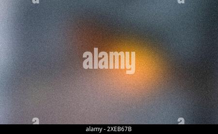 Blue background with orange highlight, bokeh, blurred abstract background with grainy noise, rough texture Stock Photo