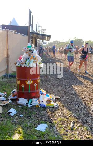 Glastonbury, Somerset, UK  26th June 2024, Overflowing bins in the food market as festival goers arrive at Glastonbury Festival  26th June 2024 Credit: Dawn Fletcher-Park/Alamy Live News Stock Photo