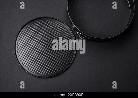 Round metal black detachable baking dish for baking Stock Photo