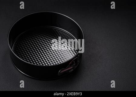 Round metal black detachable baking dish for baking Stock Photo