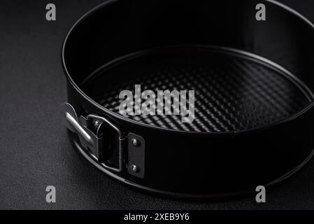 Round metal black detachable baking dish for baking Stock Photo