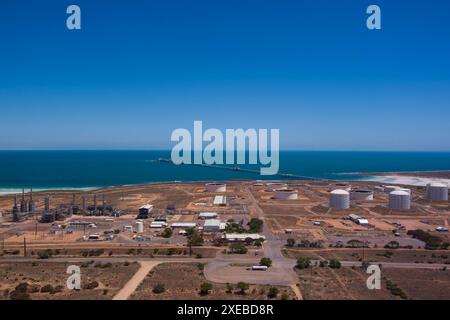 Aerial view of Port Bonython Hydrogen Hub industrial facility by the coastline with large storage tanks and clear blue skies Stock Photo