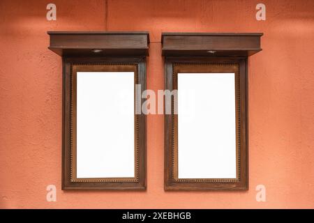 Empty notice signboard in wooden frame on rough soil earth tone background Stock Photo
