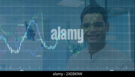 Image of financial data processing against portrait of biracial man smiling at office Stock Photo