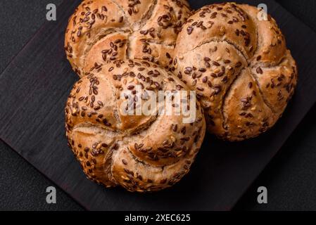 Delicious freshly baked crispy bun or kaiser roll with sesame seeds Stock Photo