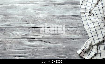 Gray wooden table with kitchen napkin, flat lay Stock Photo