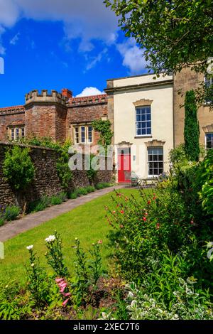 A very small and narrow Georgian style cottage in a longer terrace of houses in Wells, Somerset, England, UK Stock Photo