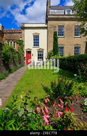 A very small and narrow Georgian style cottage in a longer terrace of houses in Wells, Somerset, England, UK Stock Photo