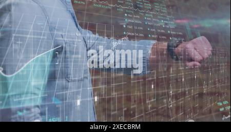 Image of data processing over caucasian businessman using smartwatch Stock Photo