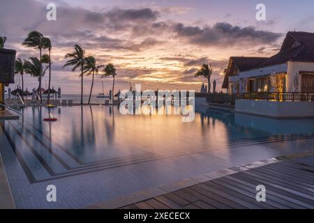 Sunrise over tropical beach hotel resort, Preskil Island, Mahebourg, Mauritius, East Africa.  Spring (May) 2024. Stock Photo