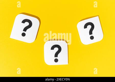 Group of Question marks signs on yellow background Stock Photo