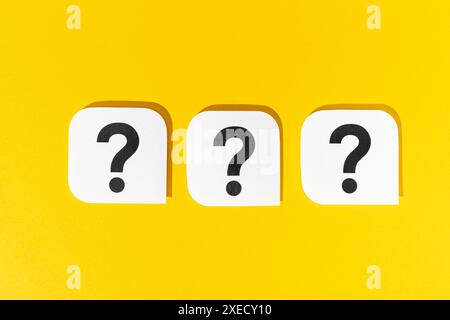 Group of Question marks signs on yellow background Stock Photo