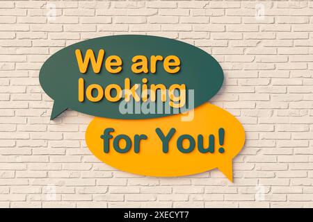 We are looking for you. We are looking for you. Cartoon speech bubble in yellow and dark green, brick wall. Hiring, searching, human resources, recrui Stock Photo