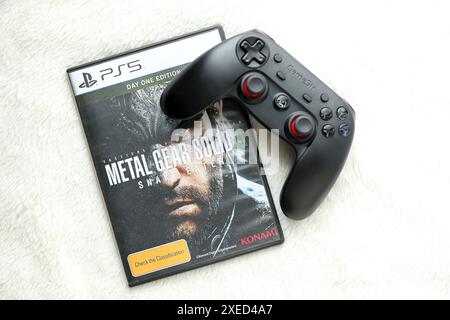 KYIV, UKRAINE - JUNE 26, 2024 Metal Gear Solid Delta Snake Eater PS5 video game disc box for console gaming. Popular video game disc close up Stock Photo