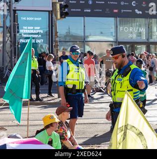 Police negotiator cautioning participants in the ‘Storm warning ...