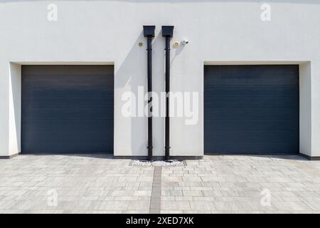 Two Modern Garage Doors on Building Stock Photo
