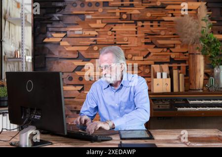Portrait of professional senior businessmen working on desktop in a modern office room Stock Photo
