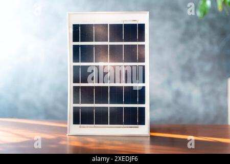 Solar panel, showing its photovoltaic cells is connected, which is storing the energy generated by the panel. The solar panel is in a sunny location, Stock Photo