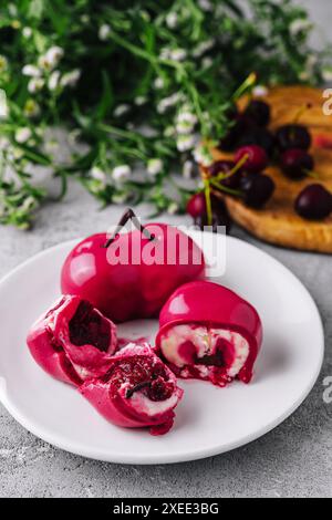 Mousse cake with mirror glaze and cherry filling Stock Photo