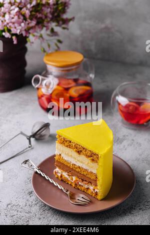 Tasty mango mousse cake on plate Stock Photo