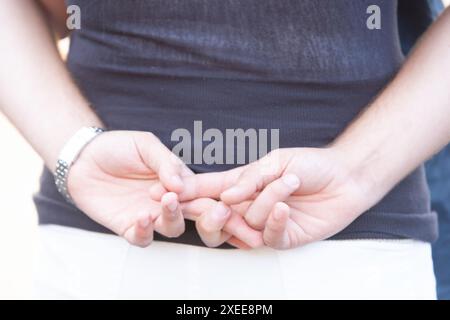 Close-Up of Man's Hands Clasped Together in a Casual Pose Stock Photo