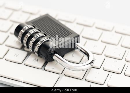 Closed padlock on computer keyboard. Cyber security concept Stock Photo