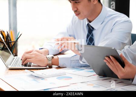 Businessman Analyzing Data on Digital Tablet Stock Photo