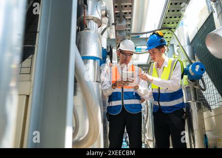 Engineers and technicians Inspect the completed air conditioning and water systems to continue verifying their functionality. Stock Photo