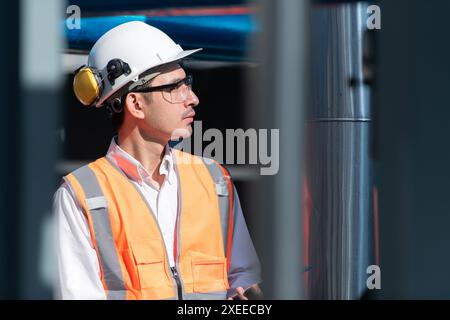 Engineers inspect the completed air conditioning and water systems to continue verifying their functionality. Stock Photo